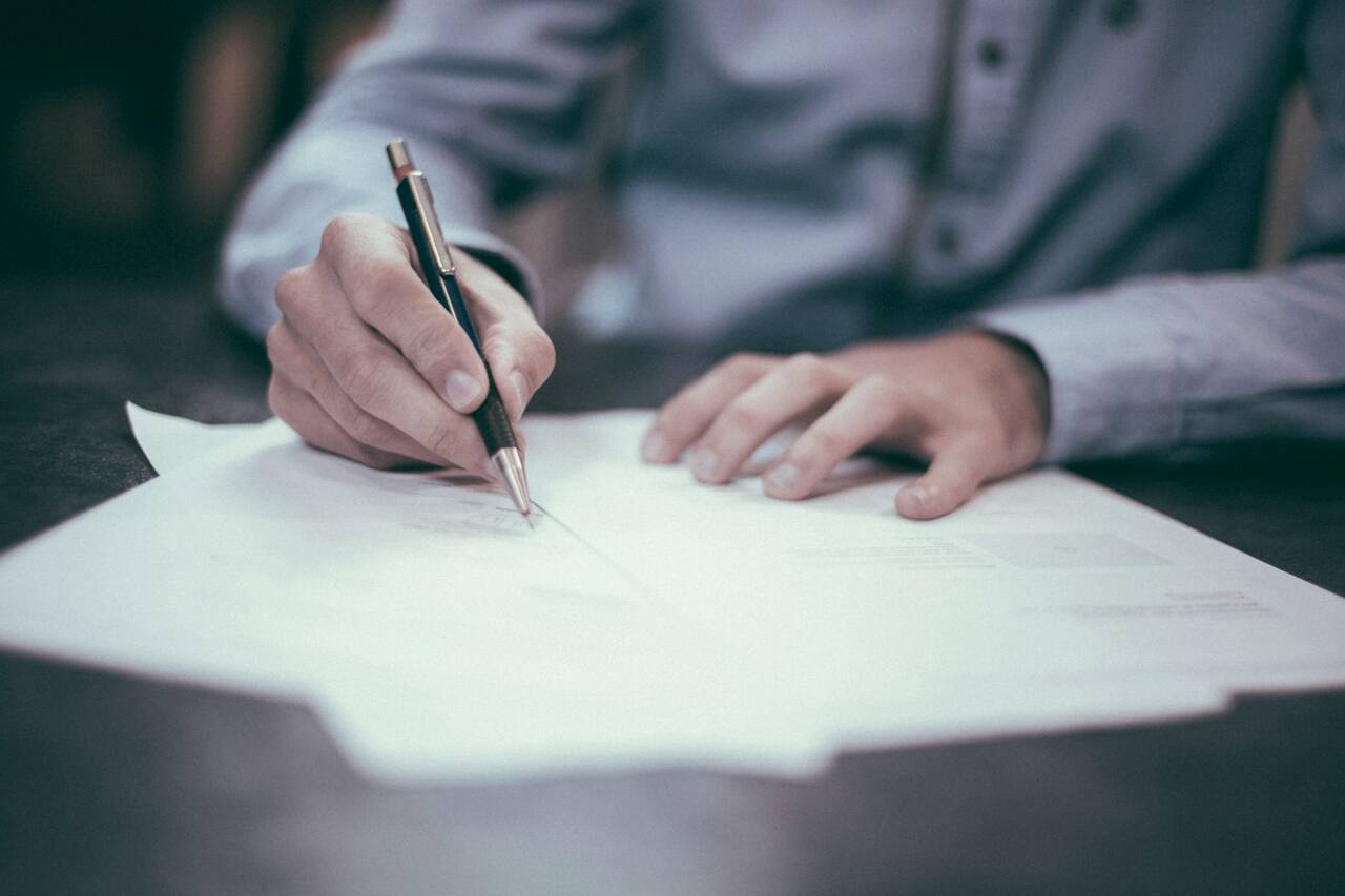 Reviewing documents and contracts at a desk