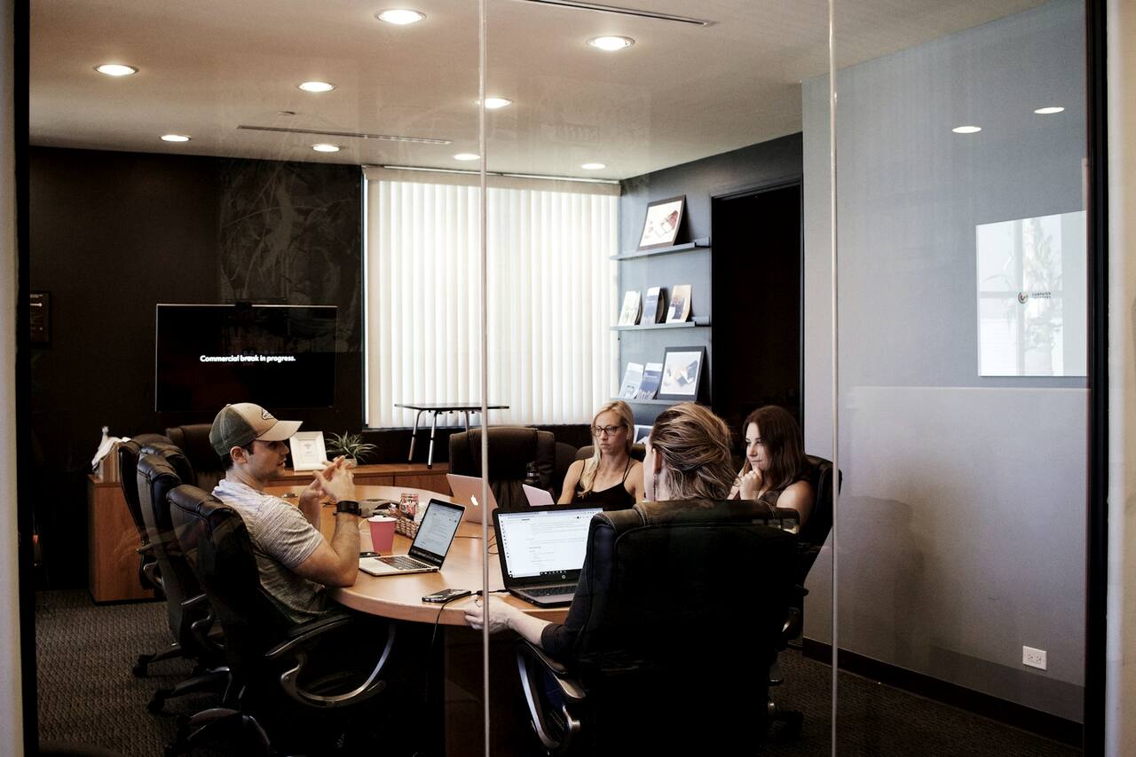 A team handoff in a firm's meeting room